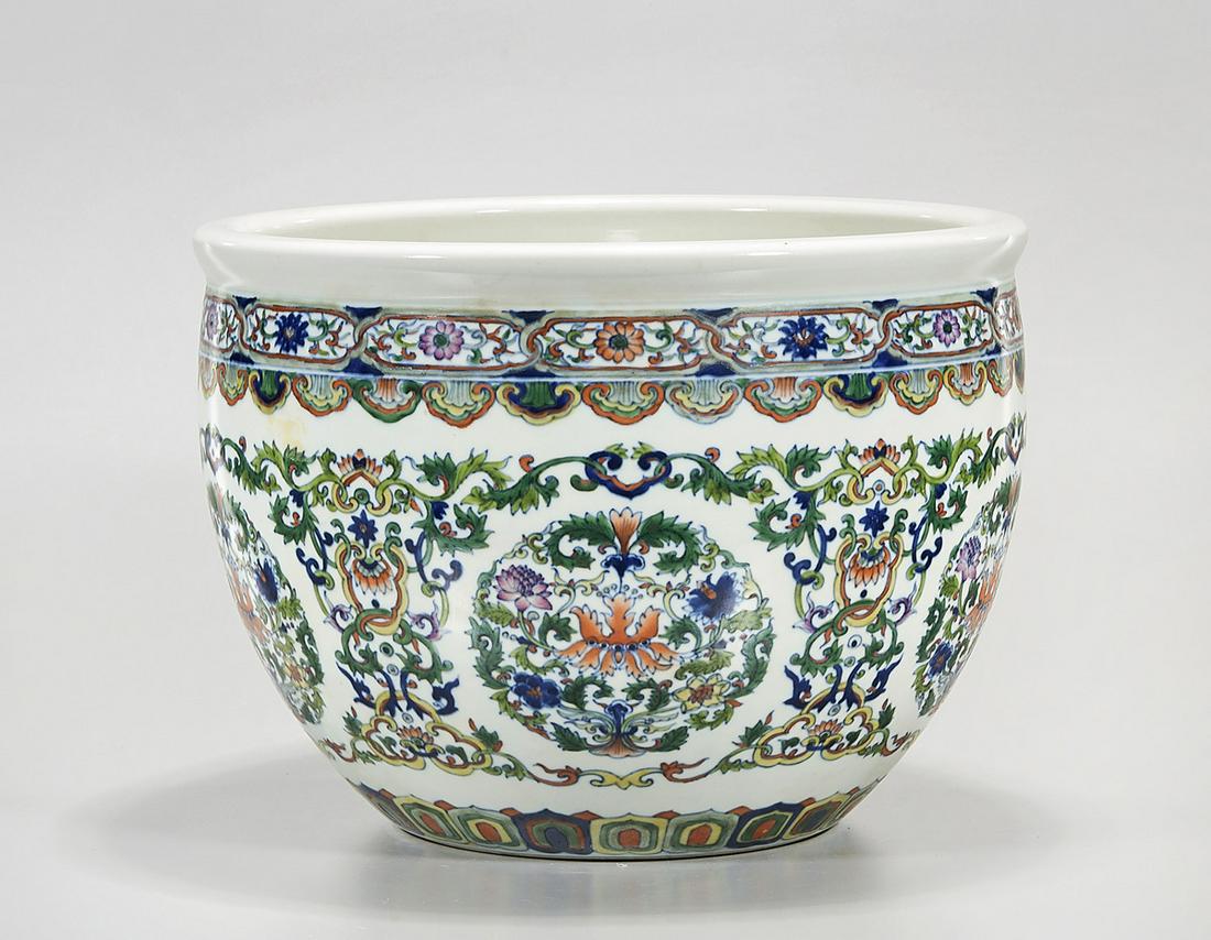 Chinese Enameled Porcelain Jardiniere: Chinese enameled porcelain jardiniere with scrolling foliage design; 9" x 12 1/2" (approx.) Condition: general wear, frits, pits, minor losses