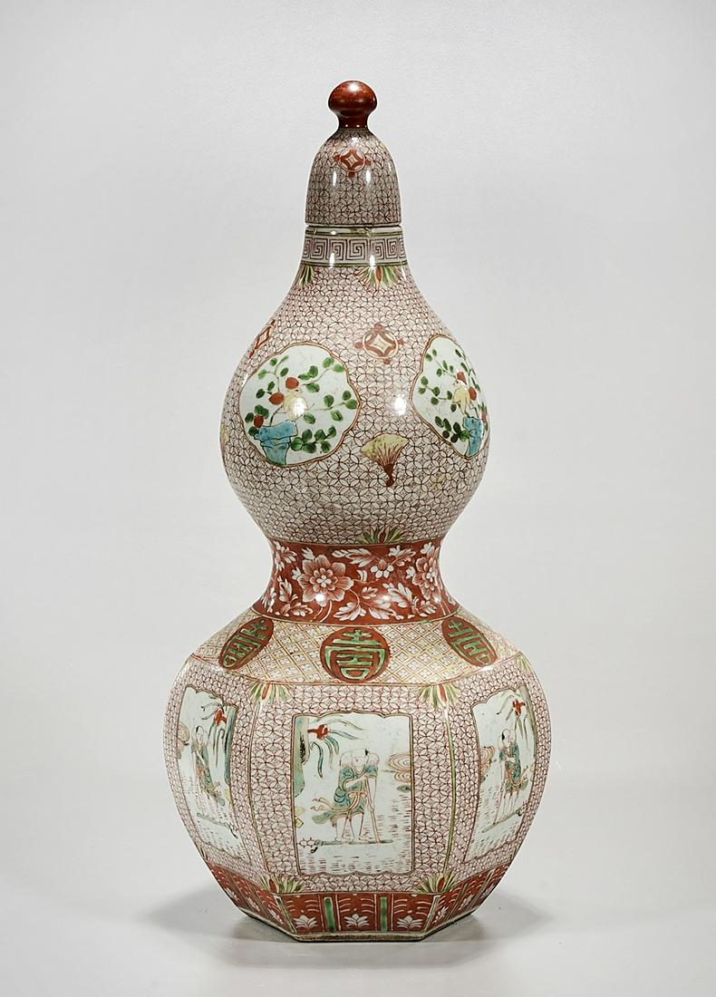 Chinese Enameled Porcelain Double Gourd Covered Vase: Chinese enameled porcelain double gourd covered vase; hexagonal lower section; depicting figures, flowers birds and characters; mark to base; 17" x 7" x 6" (approx.) Condition: general wear, frits, pi
