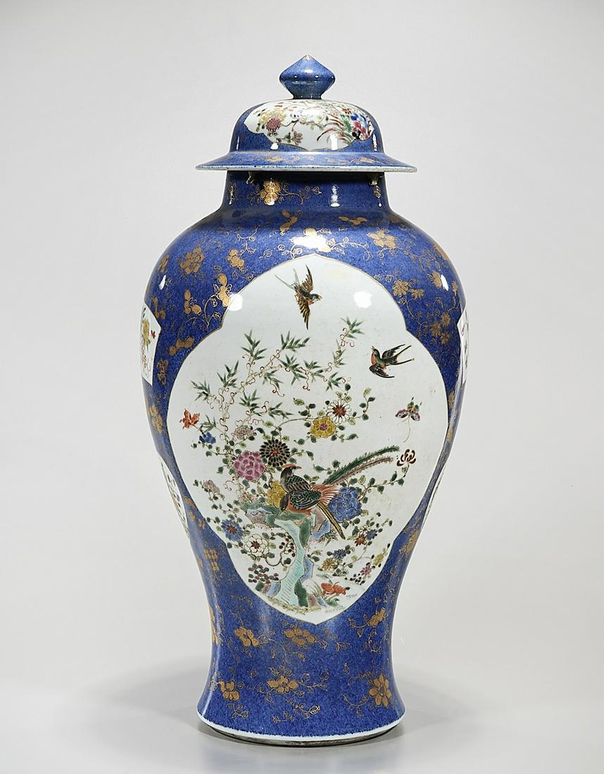 Chinese Enameled Porcelain Covered Vase: Chinese enameled porcelain covered vase; blue glaze with gilt flower design, surrounding motifs of enameled flowers and birds; 21 1/2" x 10" (approx.) Condition: general wear, frits, pits, minor losse