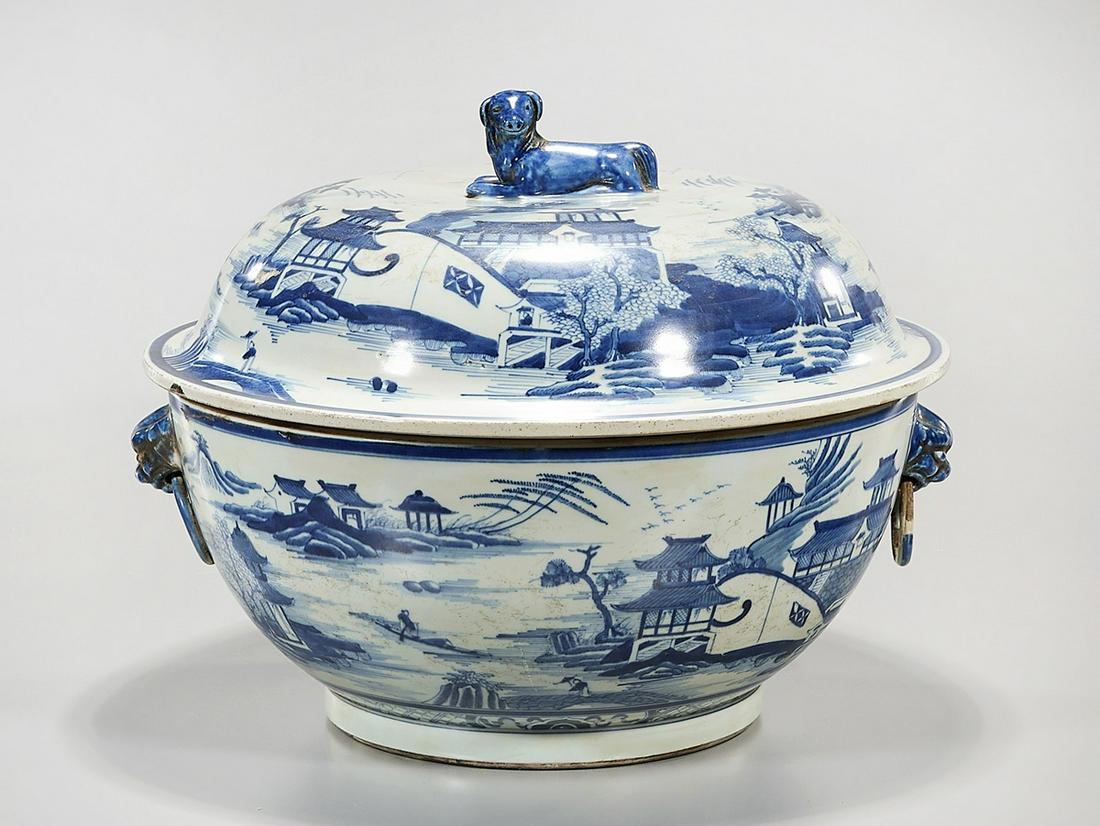 Chinese Blue and White Porcelain Covered Basin: Chinese blue and white porcelain covered basin; depicting various landscapes with figures; dog finial; 11 1/2" x 14" (approx.) Condition: general wear, frits, pits, minor losses