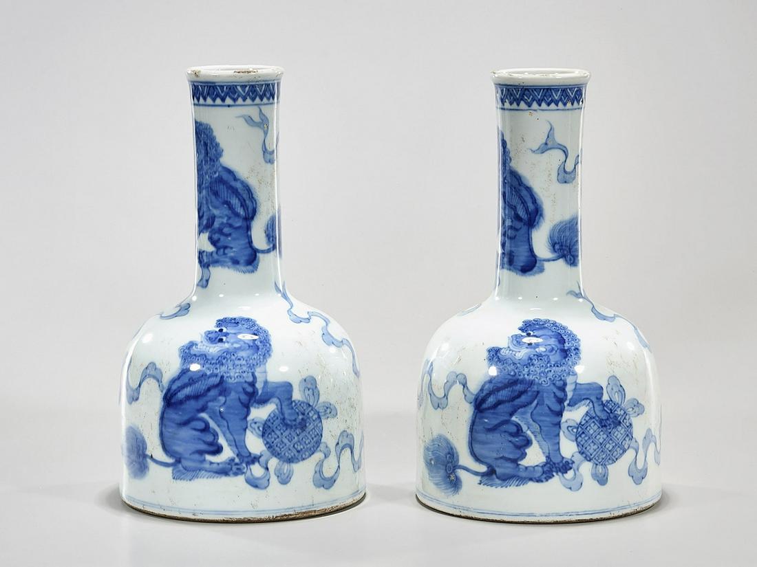 Two Chinese Blue and White Porcelain Vases: Two Chinese blue and white porcelain bell vases; qilin design; concentric rings to bases; 11 1/2" x 7" (approx.) Condition: wear, frits, pits, minor loss