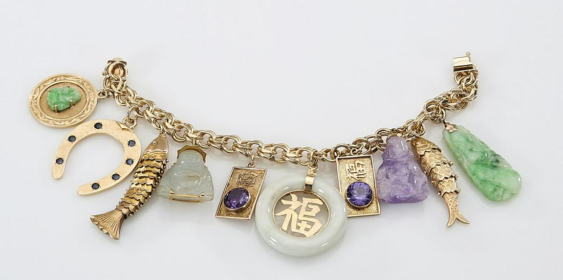 14K Yellow Gold Charm Bracelet: 14k yellow gold charm bracelet; ten charms; each charm tested or marked 14k except bale on amethyst; gross weight 96g