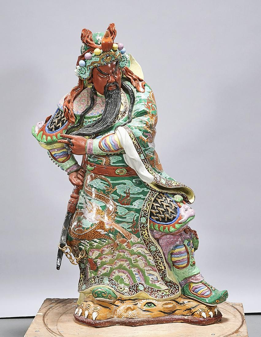 Chinese Enameled Porcelain Figure of Guandi: Chinese enameled porcelain Guandi figure; 33 1/4" x 22" x 13" (approx.) Condition: broken sword; wear, frits, pits, minor losses