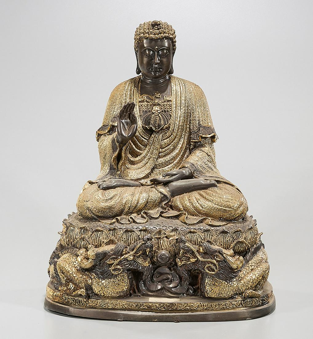 Chinese Gilt Metal Seated Buddha: Chinese gilt metal Buddha, seated upon lotus with double dragon base; one piece; 16" x 12" x 9" (approx.) Condition: wear, minor loss