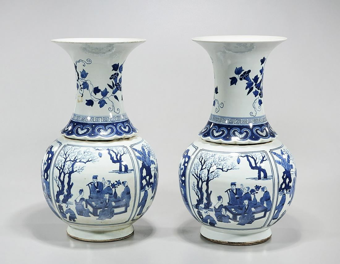 Pair Chinese Blue and White Porcelain Vases: Pair of Chinese blue and white porcelain vases; with various scenes of figures; 16" x 9" (each, approx.) Condition: wear, frits, pits, minor loss