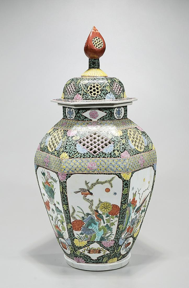 Tall Chinese Enameled Porcelain Hexagonal Covered Vase: Tall Chinese enameled porcelain hexagonal covered vase; openwork carving; trees, birds and flowers decoration; 25" x 11" (approx.) Condition: wear, frits, pits, minor loss