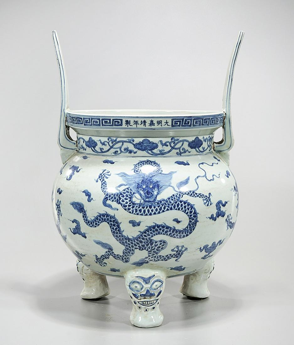 Chinese Blue and White Porcelain Censer: Chinese blue and white porcelain tripod censer; dragon motif; Jiajing mark; 20 1/2" x 15" (approx.) Condition: wear, frits, pits, minor loss
