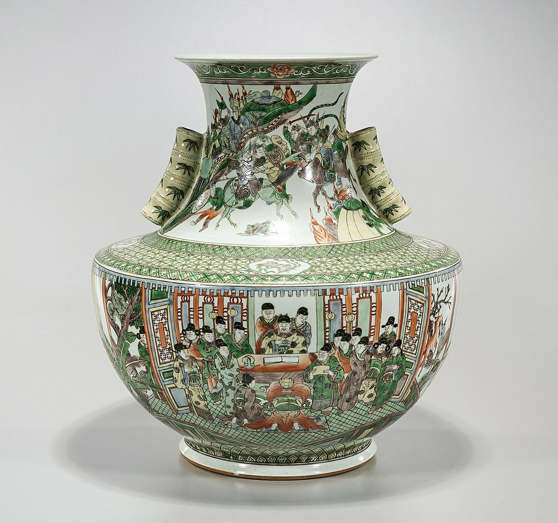 Chinese Enameled Porcelain Vase: Chinese enameled porcelain vase; depicting figures in various settings; pierced bamboo-form handles; 18" x 16" (approx.) Condition: wear, frits, pits, minor loss