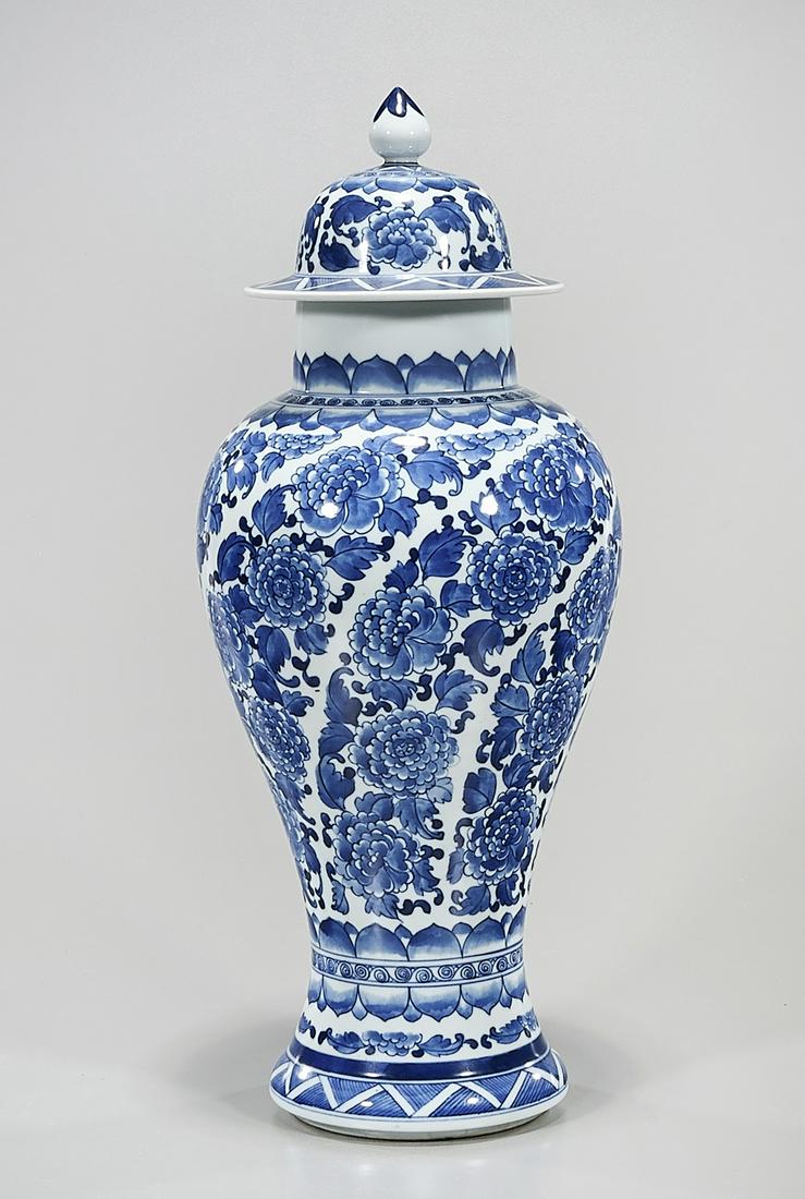 Chinese Blue and White Porcelain Covered Vase: Chinese blue and white porcelain covered vase; floral design; 17" x 7" (approx.) Condition: wear, frits, pits, minor loss
