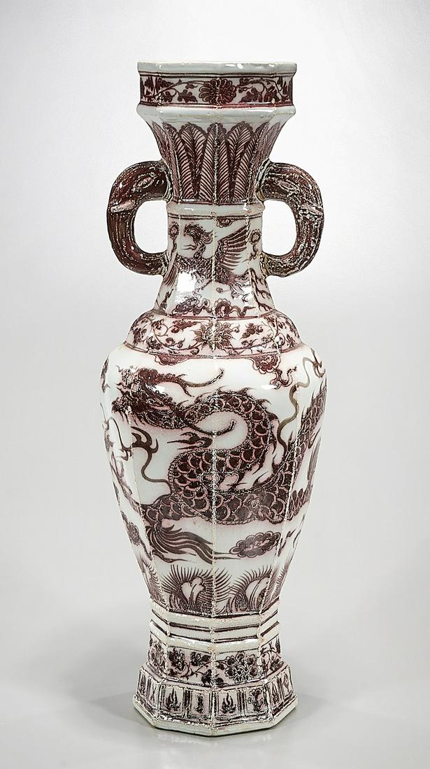 Chinese Red and White Porcelain Octagonal Vase: Chinese red and white porcelain octagonal vase; dragon chasing pearls; elephant head handles; (approx.) Condition: wear, frits, pits, minor loss