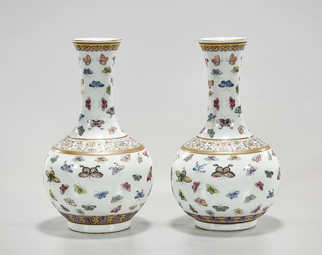Pair Chinese Enameled Porcelain Vases: Pair of Chinese enameled porcelain globular vases; famille rose butterfly design; 9 1/2" x 5" (each, approx.) Condition: wear, frits, pits, minor loss