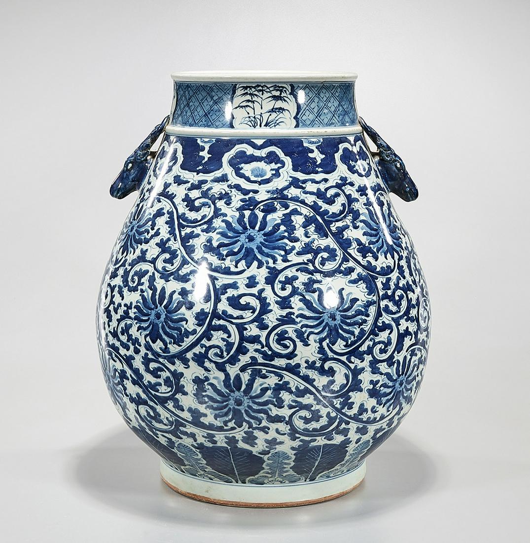 Chinese Blue and White Porcelain Zun: Chinese blue and white porcelain deer head zun vase; scrolling floral pattern; 18" x 13" (approx.) Condition: wear, frits, pits, minor loss