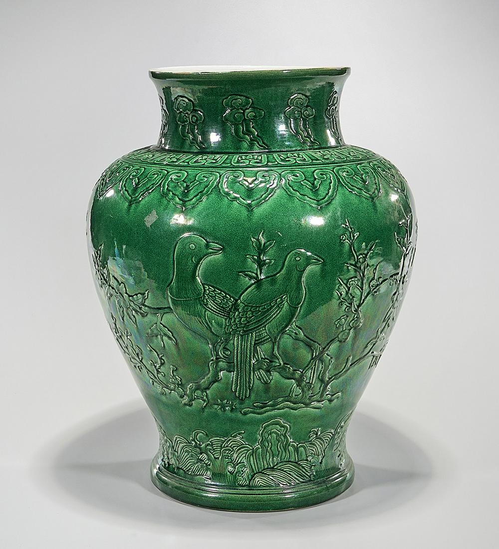 Large Chinese Green Glazed Porcelain Vase: Large Chinese green glazed porcelain vase; decorated with flowers in relief; 21 1/4" x 16" (approx.) Condition: wear, frits, pits, minor loss
