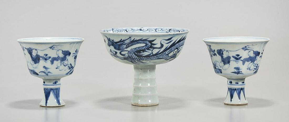Three Chinese Blue and White Porcelain Stem Cups: Three Chinese blue and white porcelain stem cups; Yuan and Ming styles; 4 1/2" x 5" (tallest, approx.) Condition: wear, frits, pits, minor loss