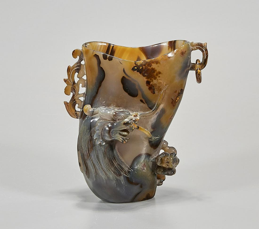 Chinese Carnelian Cup: Chinese carnelian cup; dragon design; 6" x 6" x 4" (approx.) Condition: wear, surface scratching, minor loss
