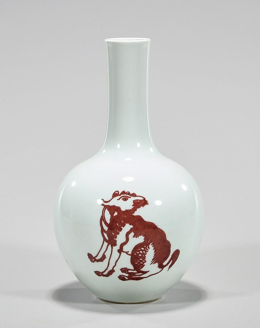 Chinese Red Glazed Porcelain Globular Vase: Chinese porcelain vase with red glaze design; Kangxi mark to base; 8" x 4 1/2" (approx.) Condition: wear, frits, pits, minor loss