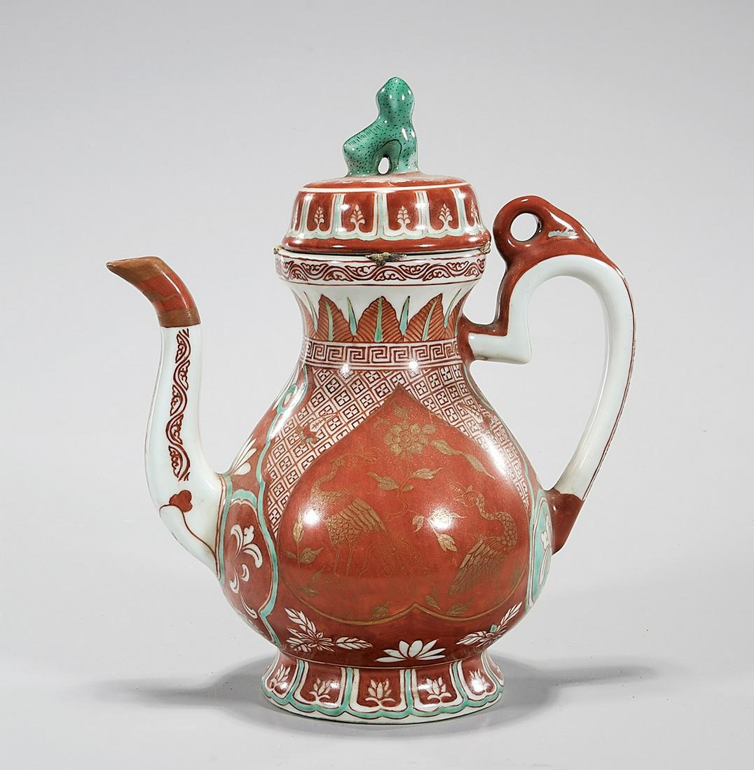 Chinese Coral Red Glazed Porcelain Vessel: Chinese coral red glazed porcelain covered vessel; 10" x 8 1/2" x 5" (approx.) Condition: wear, frits, pits, minor loss