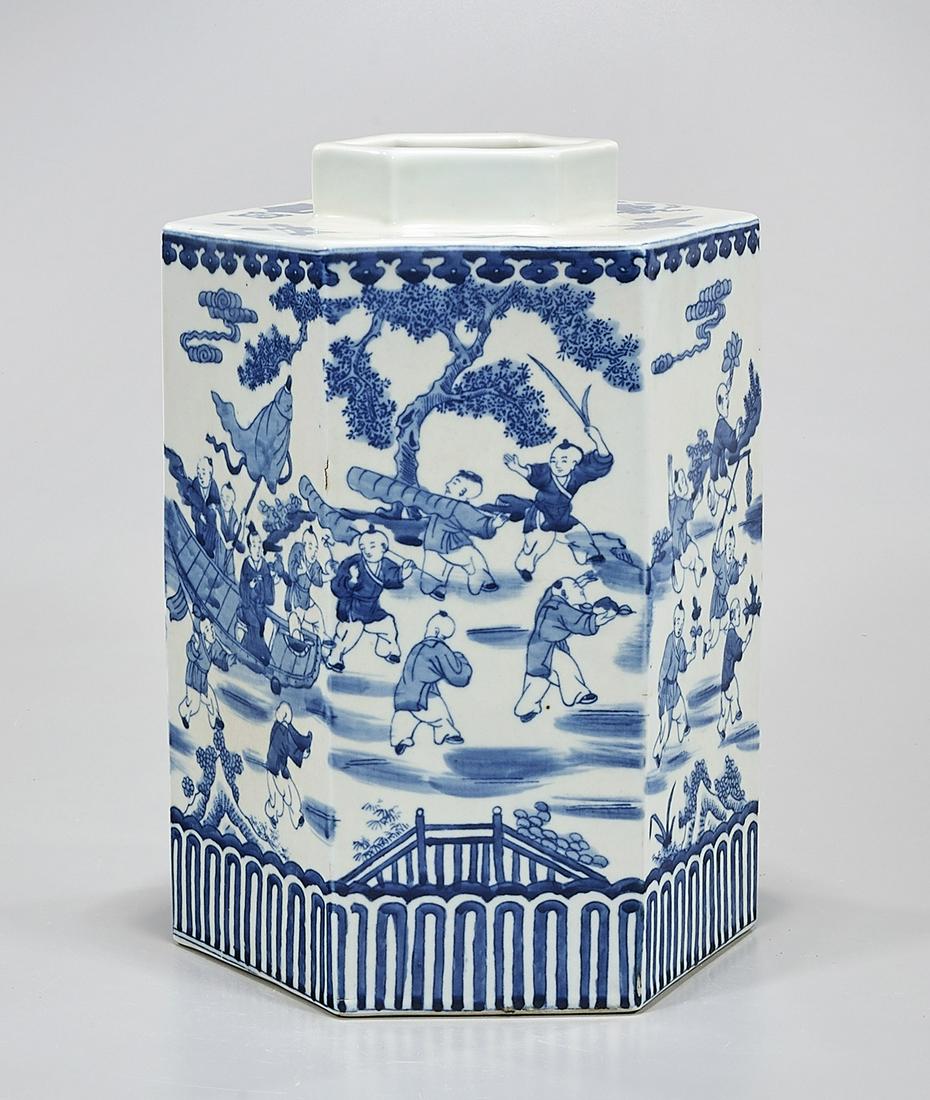 Chinese Blue and White Porcelain Hexagonal Vase: Chinese blue and white porcelain hexagonal vase; depicting children at play in a landscape; Kangxi mark to base; 12 1/2" x 9" (approx.) Condition: wear, frits, pits, minor loss