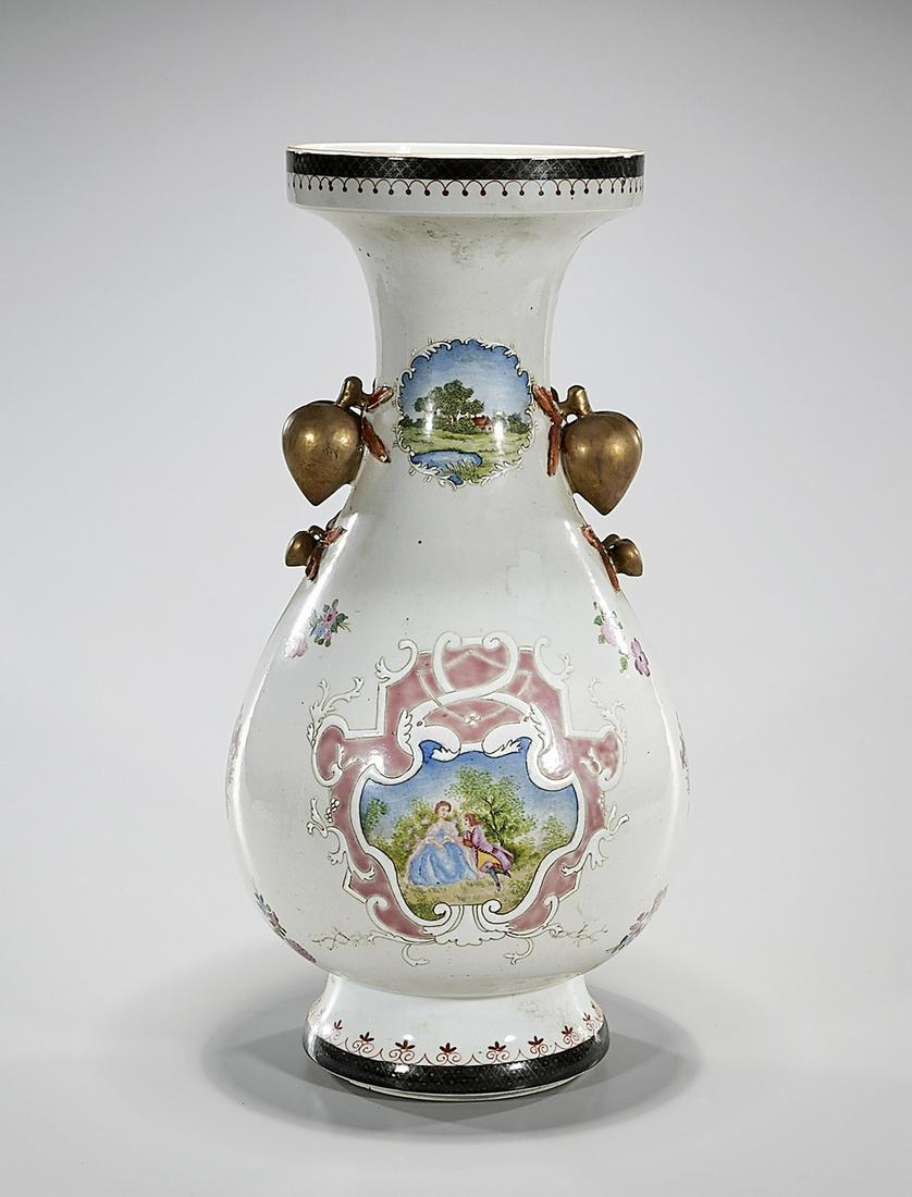 Chinese Enameled Porcelain Vase: Chinese enameled porcelain vase with high relief fruit and European scene motifs; 19 1/2" x 10" (approx.) Condition: general wear, frits, pits, minor losses