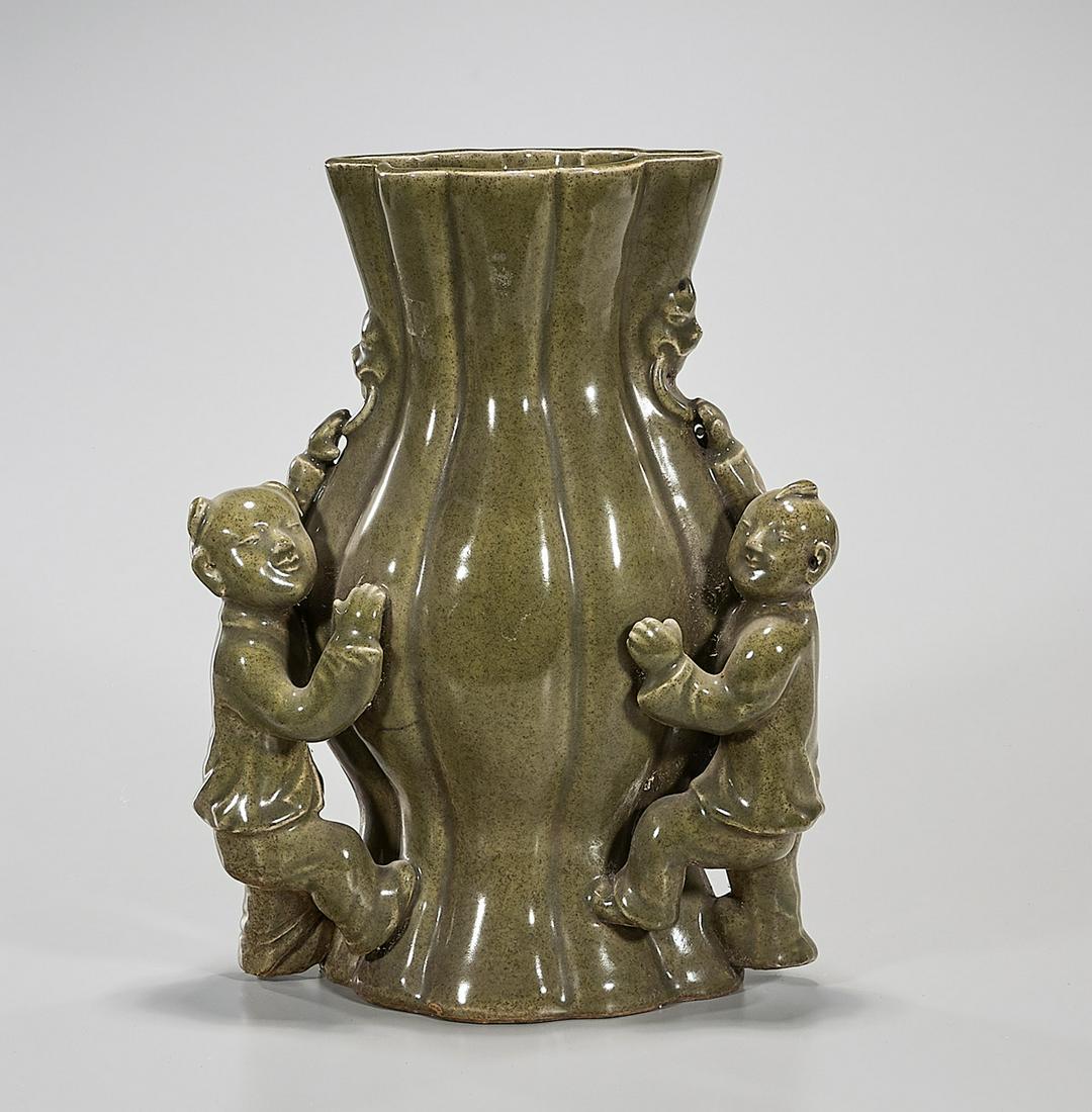 Chinese Green Glazed Porcelain Vase: Chinese green glazed porcelain vase; high relief children design; 14" x 11" x 6" (approx.) Condition: general wear, frits, pits, minor chips