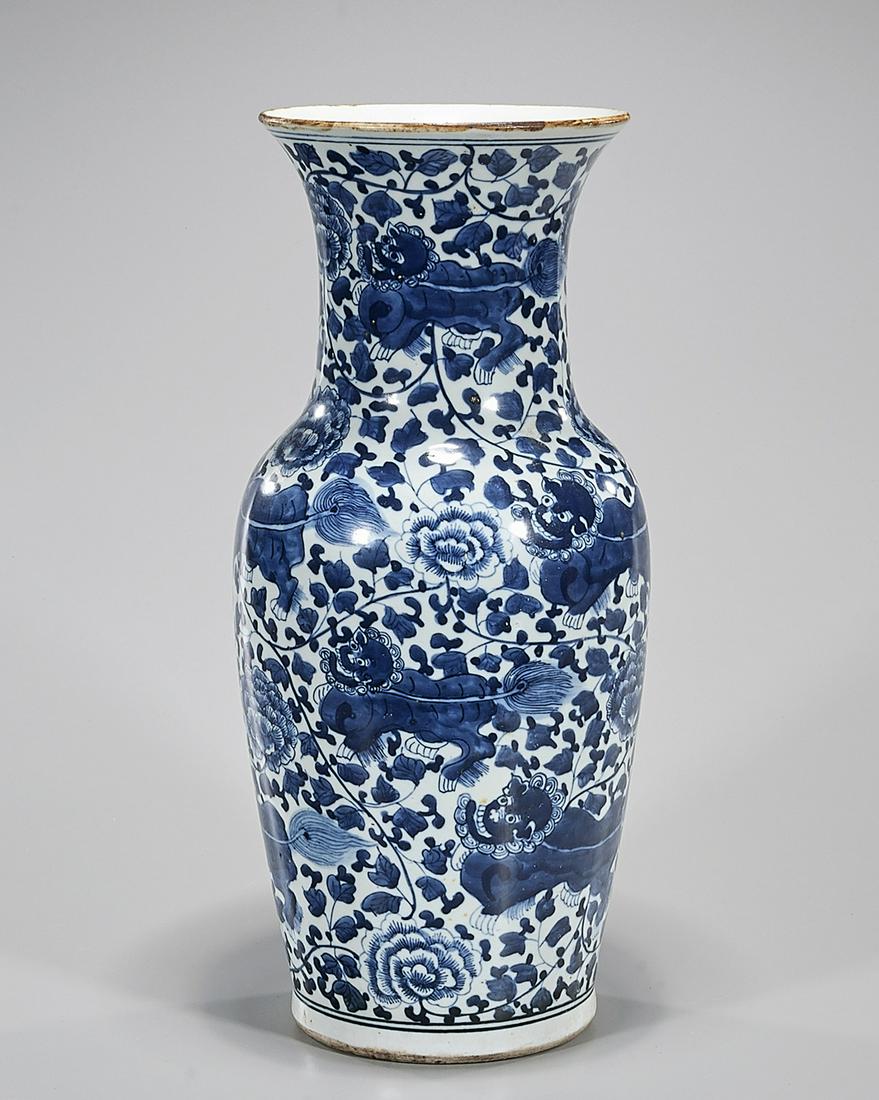 Chinese Blue and White Porcelain Vase: Chinese blue and white porcelain vase with floral design; 17" x 7" (approx.) Condition: general wear, frits, pits, minor chips
