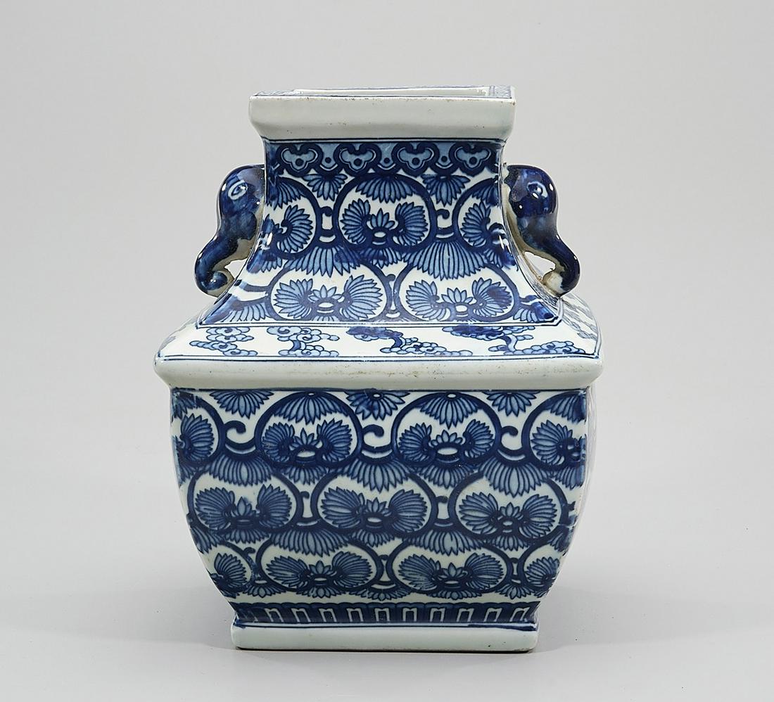 Chinese Blue and White Porcelain Four-Faceted Vase: Chinese blue and white porcelain four-faceted vase; elephant heads to neck; 10 1/2" x 7 1/2" (approx.) Condition: wear, frits, pits, minor loss
