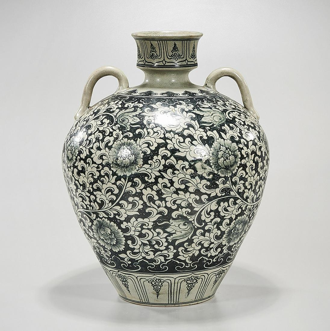 Chinese Glazed Porcelain Jar: Chinese glazed porcelain jar; flower and foliage design; handles to shoulder; 15" x 12" (approx.) Condition: general wear, frits, pits, minor losses