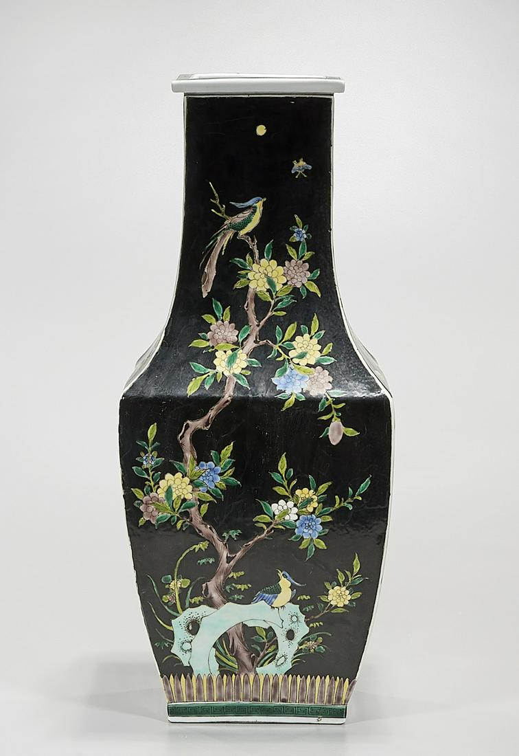 Chinese Enameled Porcelain Four-Faceted Vase: Chinese enameled porcelain four-faceted vase; black glaze, enameled trees, birds and flowers; 20 1/2" x 8 1/2" x 7" (approx.) Condition: general wear, frits, pits, minor losses