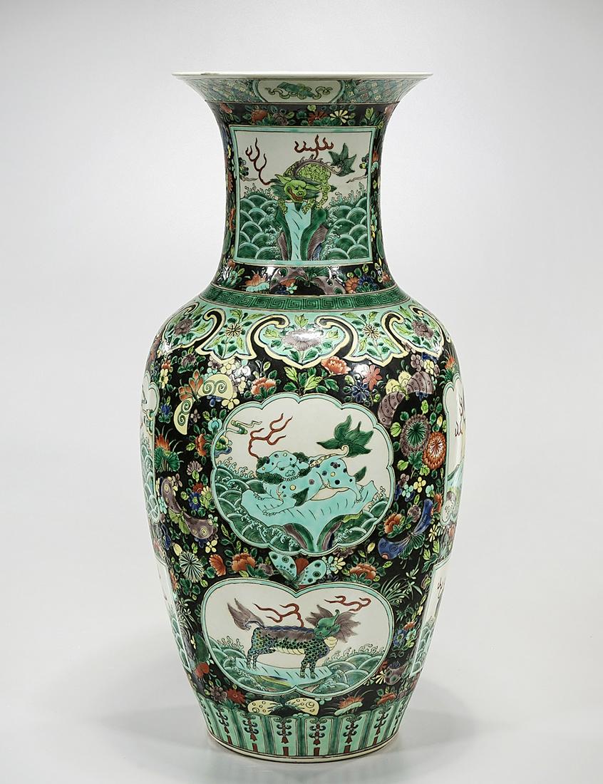 Tall Chinese Enameled Porcelain Vase: Tall Chinese enameled porcelain vase; scenes of qilin, surrounded by floral design; 24" x 12" (approx.) Condition: general wear, frits, pits, minor losses