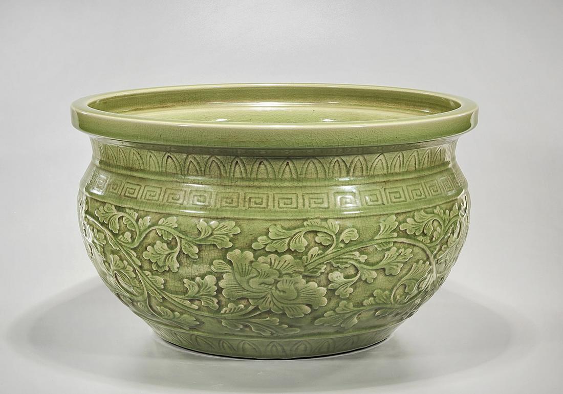 Chinese Glazed Porcelain Fish Bowl: Chinese green glazed porcelain fish bowl with floral design; 12" x 21" (approx.) Condition: general wear, frits, pits, minor losses