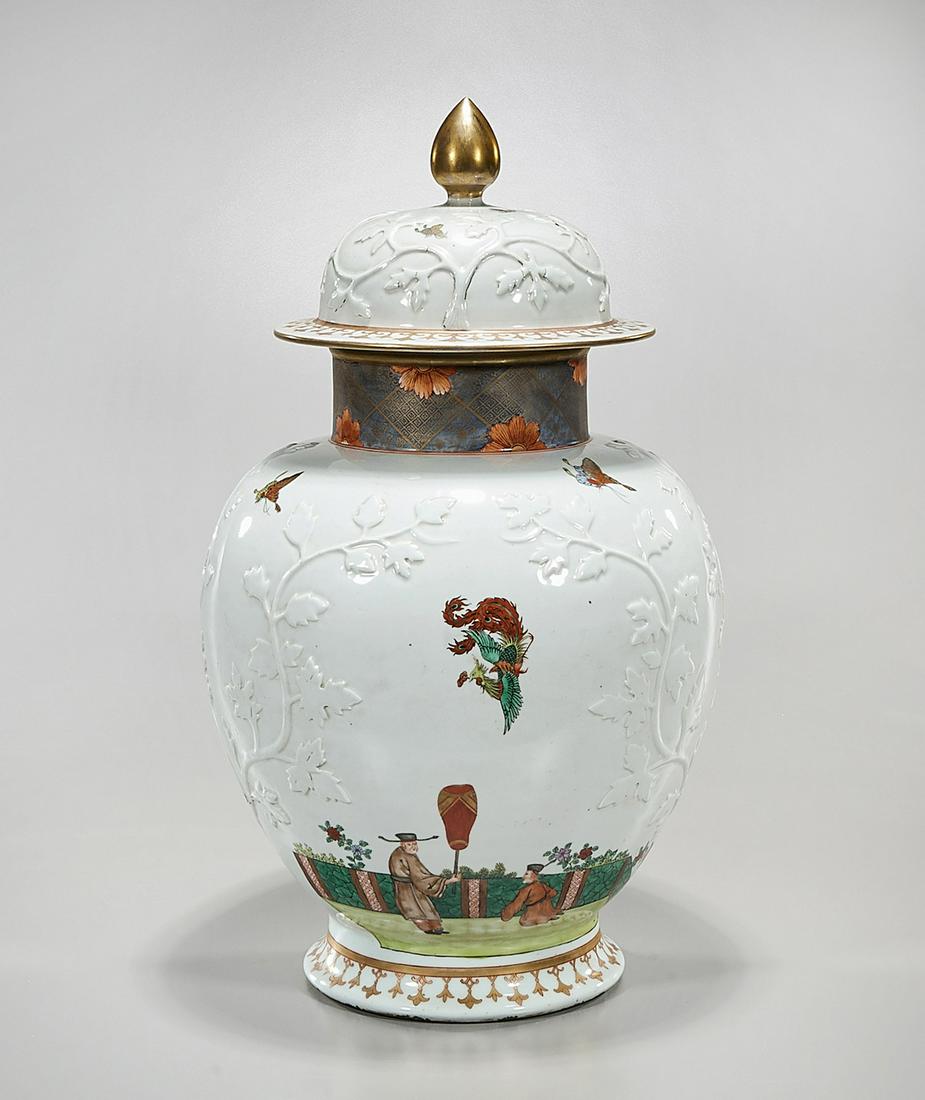 Tall Chinese Glazed Porcelain Covered Vase: Tall Chinese glazed porcelain covered vase; with painted figures and butterflies; leaves in relief; 22" x 14" (approx.) Condition: general wear, frits, pits, minor losses