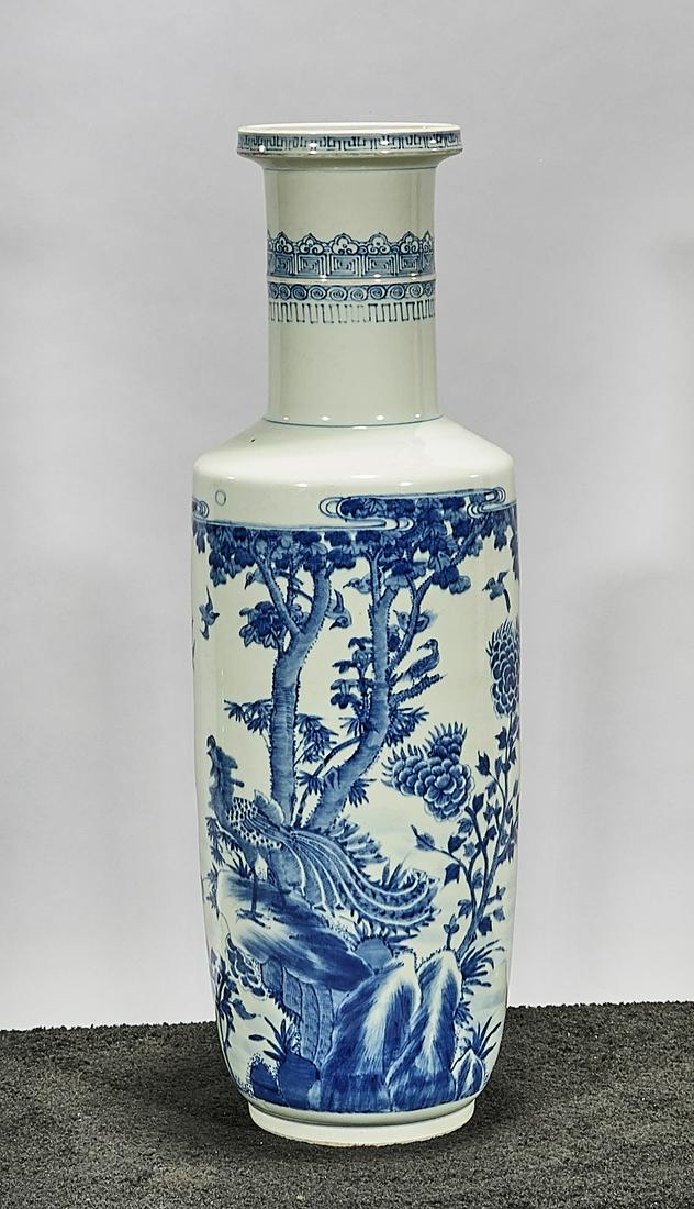 Tall Chinese Blue and White Porcelain Vase: Tall Chinese blue and white porcelain Kangxi-style vase; with birds and trees decoration; concentric rings to base; 30" x 8" (approx.) Condition: wear, frits, pits, minor loss