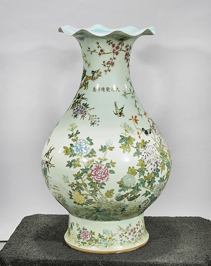 Tall Chinese Enameled Porcelain Vase: Tall Chinese enameled porcelain bulbous vase; with petal form mouth; trees, flowers and birds decoration; Qianlong mark but later; 32 1/2" x 22 1/2" (approx.) Condition: wear, frits, pits, minor loss