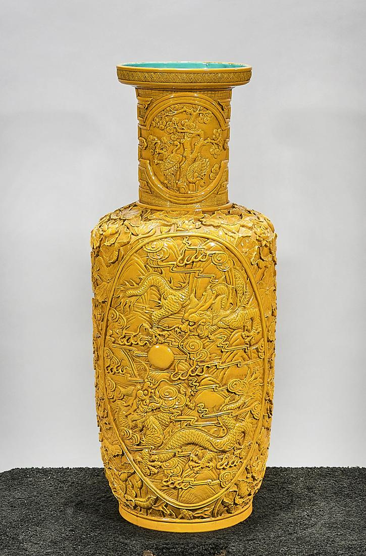 Tall Chinese Glazed Porcelain Vase: Tall Chinese yellow glazed porcelain Kangxi-style vase; molded design of dragons chasing pearls, flanked by flowers; mark; 33" x 14" (approx.) Condition: wear, frits, pits, minor loss