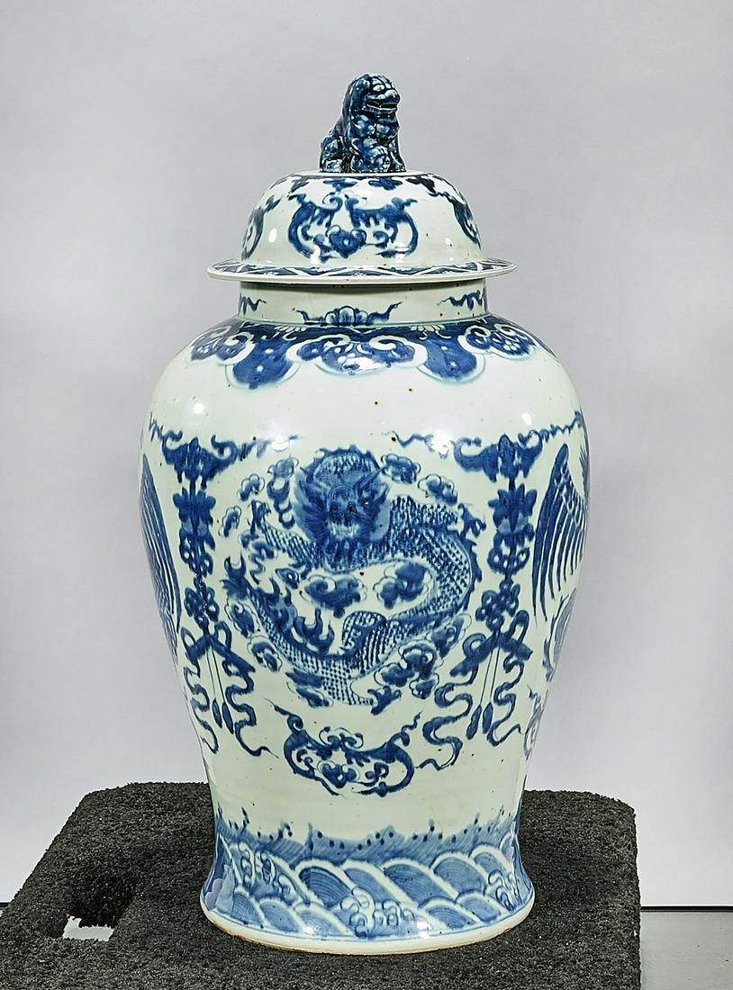 Tall Chinese Blue and White Porcelain Covered Vase: Tall Chinese blue and white porcelain covered vase; dragon and phoenix motif; 28" x 17" (approx.) Condition: wear, frits, pits, minor loss