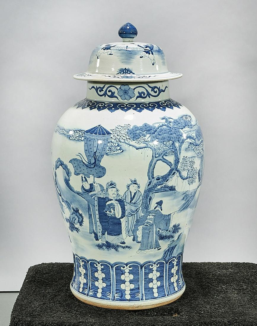 Tall Chinese Blue and White Porcelain Covered Vase: Tall Chinese blue and white porcelain covered vase; depicting figures in a landscape setting; 33" x 22" (approx.) Condition: wear, frits, pits, minor loss