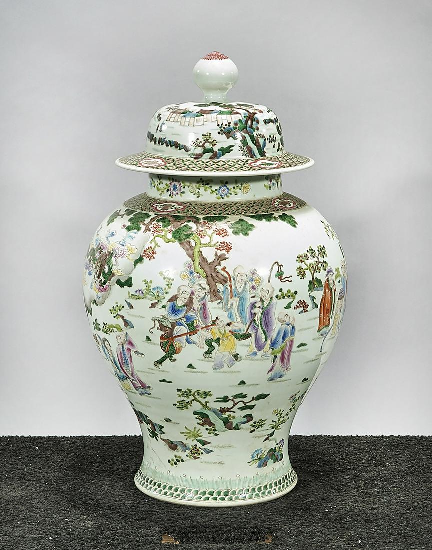 Tall Chinese Enameled Porcelain Covered Vase: Tall Chinese enameled porcelain covered vase; showing figures in a variety of settings; 25" x 14" (approx.) Condition: wear, frits, pits, minor loss