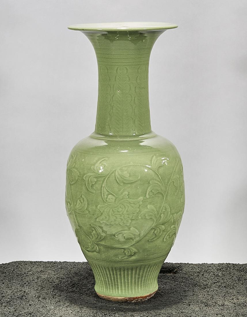 Tall Chinese Celadon Porcelain Vase: Tall Chinese celadon glazed porcelain vase; raised floral design; 25" x 11" (approx.) Condition: wear, frits, pits, minor loss