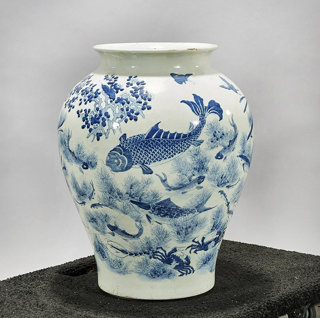 Chinese Blue and White Porcelain Vase: Chinese blue and white porcelain vase; with fish motif; concentric rings to base; 20" x 18" (approx.) Condition: wear, frits, pits, minor loss