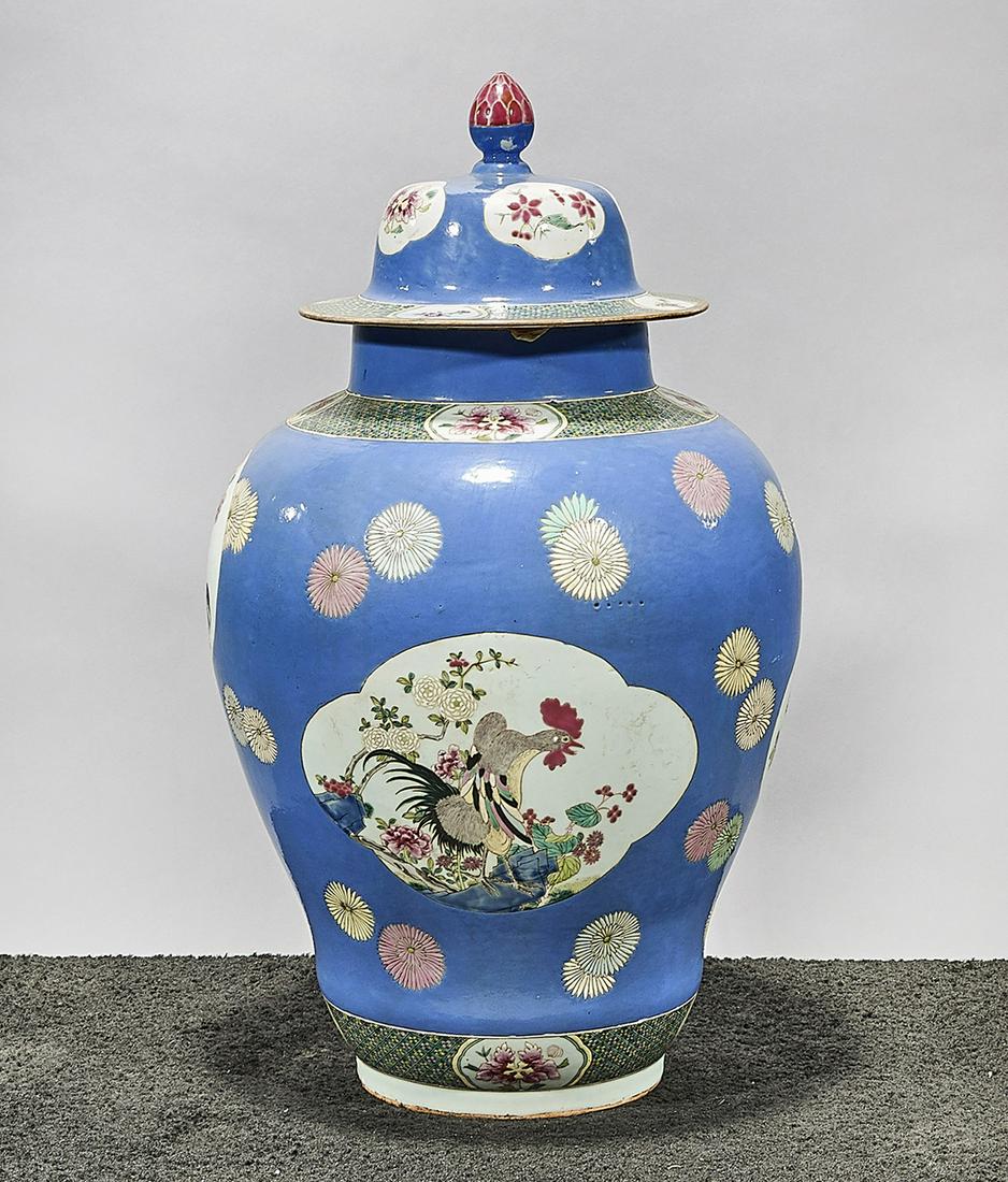 Tall Chinese Enameled Porcelain Covered Vase: Tall Chinese enameled porcelain covered vase; scenes of roosters with flowers, surrounded by floral motif over blue ground; 24 1/2" x 14" (approx.) Condition: wear, frits, pits, minor loss