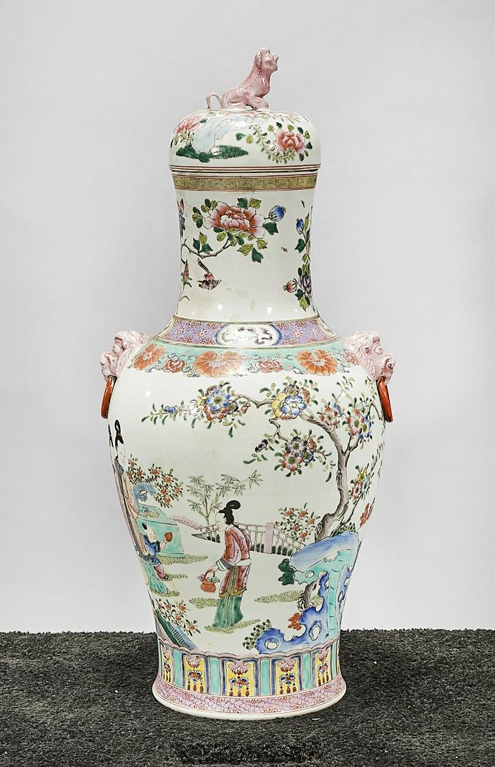 Tall Chinese Enameled Porcelain Covered Vase: Tall Chinese enameled porcelain covered vase; famille rose; depicting figures in a landscape; mark to base; 28" x 12" (approx.) Condition: wear, frits, pits, minor loss