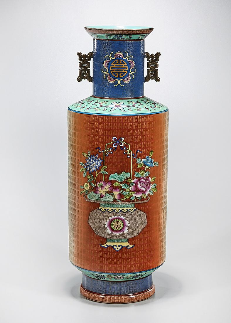 Chinese Enameled Porcelain Vase: Chinese enameled porcelain Kangxi-style vase; gilt handles to neck; floral motifs with repeating character design; mark to base; 22 1/2" x 8 1/2" (approx.) Condition: wear, frits, pits, minor loss
