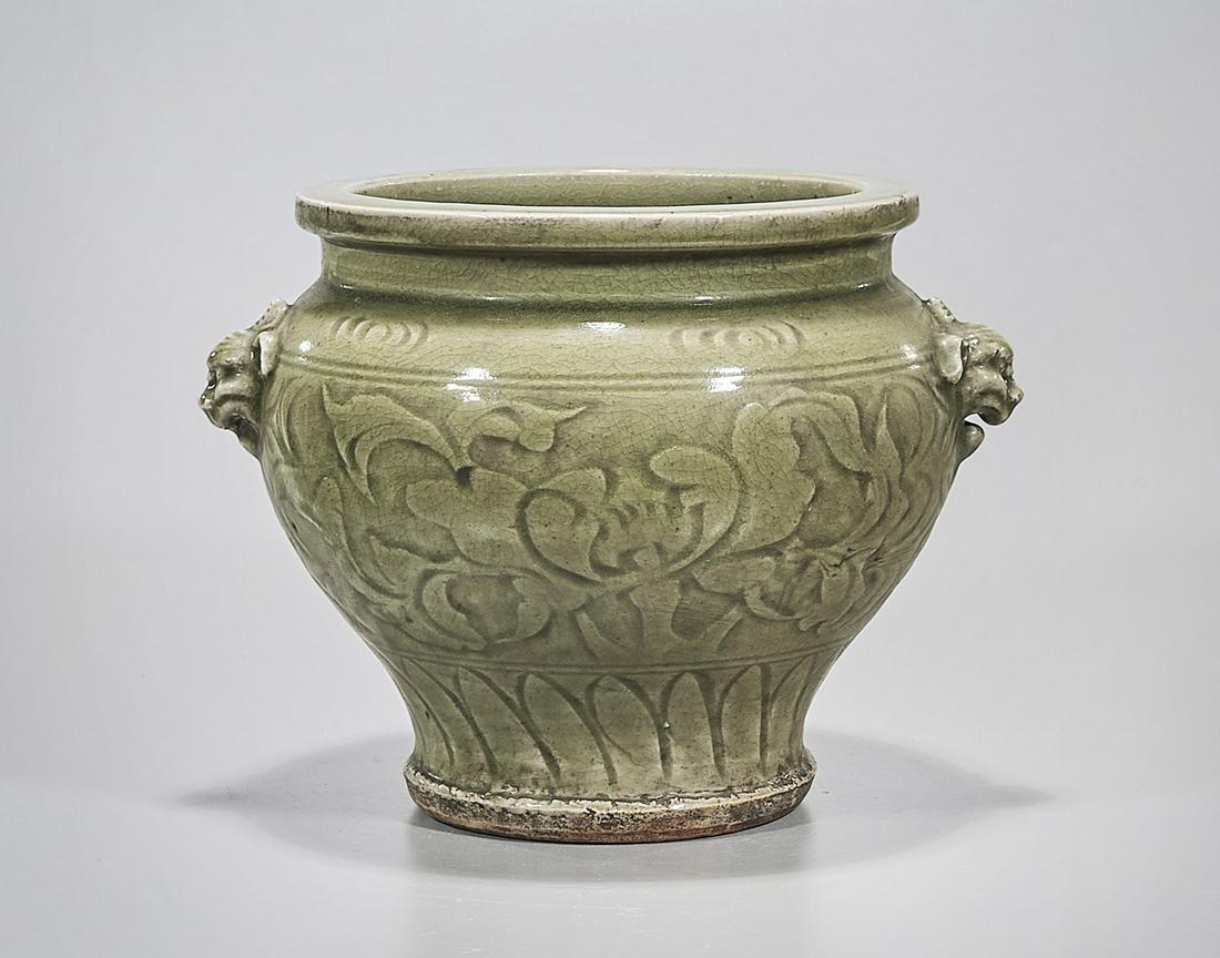 Chinese Celadon Glazed Porcelain Vase: Chinese celadon glazed porcelain vase; floral design with animal head molds to shoulder; 11 1/2" x 12 1/2" (approx.) Condition: wear, frits, pits, minor loss