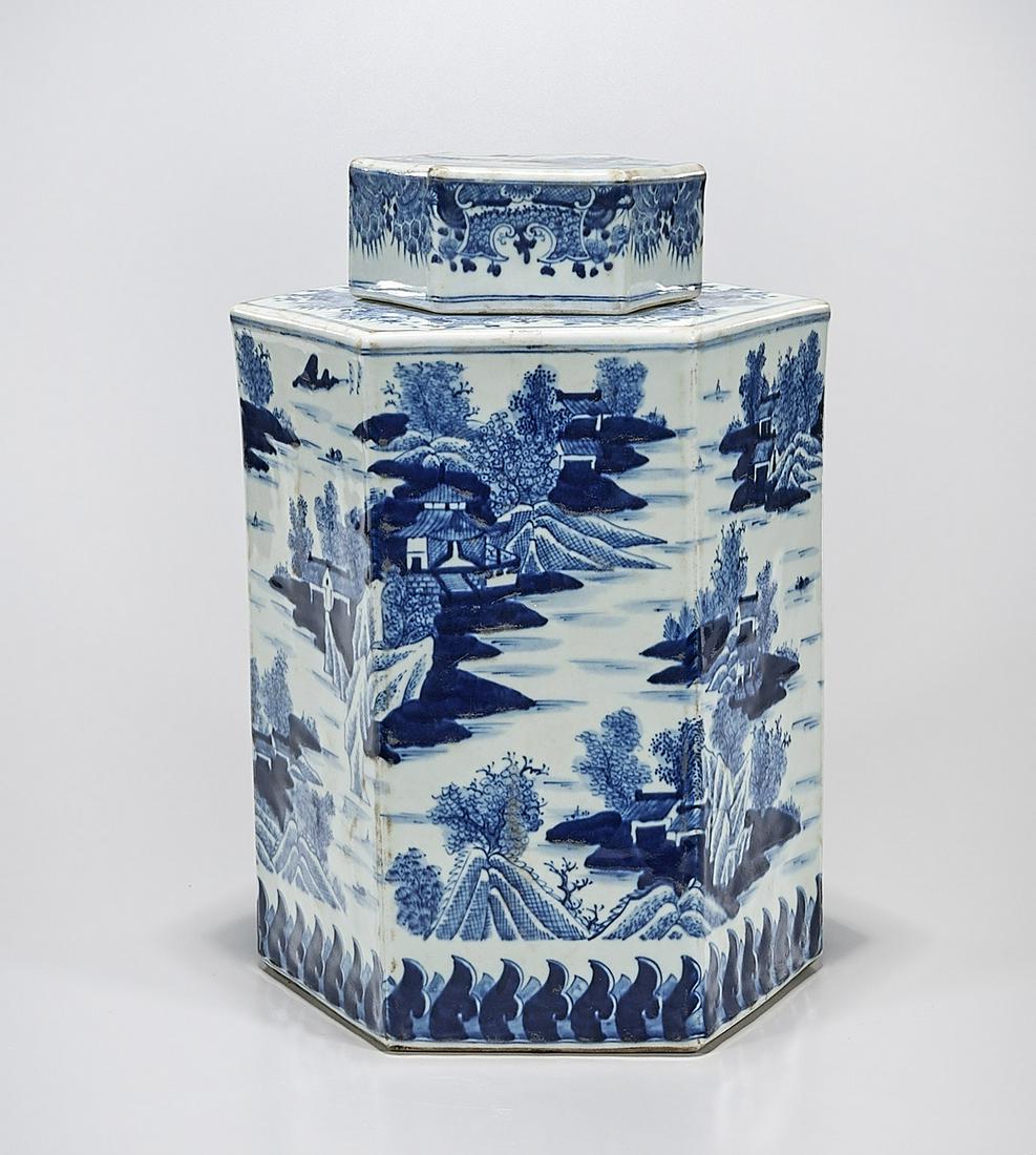 Chinese Blue and White Porcelain Covered Container: Chinese blue and white porcelain octagonal covered container; depicting landscape scenes; 14 1/2" x 11" x 9 1/2" (approx.) Condition: wear, frits, pits, minor loss
