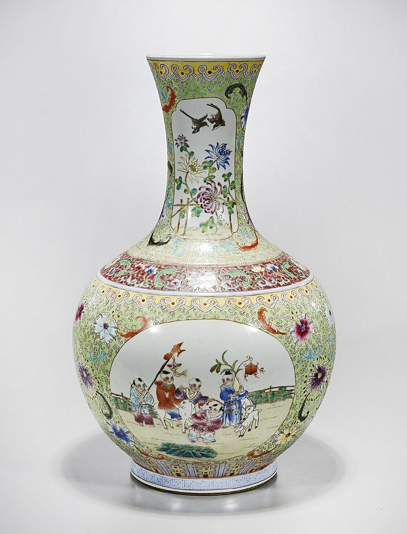 Tall Chinese Enameled Porcelain Vase: Tall Chinese enameled porcelain vase; depicting children at play; flanked by floral design; 23" x 15" (approx.) Condition: wear, frits, pits, minor loss
