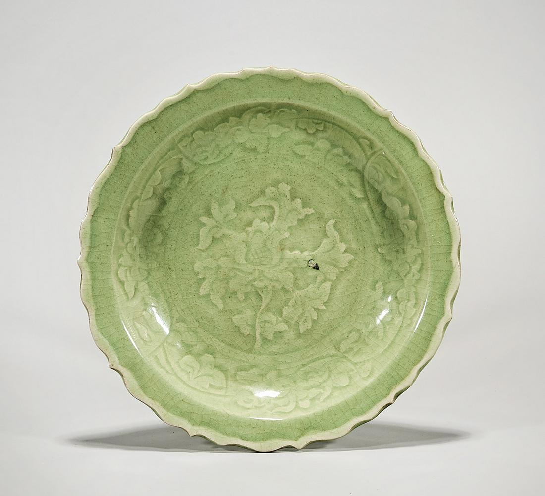 Chinese Celadon Glazed Porcelain Charger: Chinese celadon glazed porcelain charger; floral motif; 2 1/2" x 12" (approx.) Condition: general wear, frits, pits, minor losses