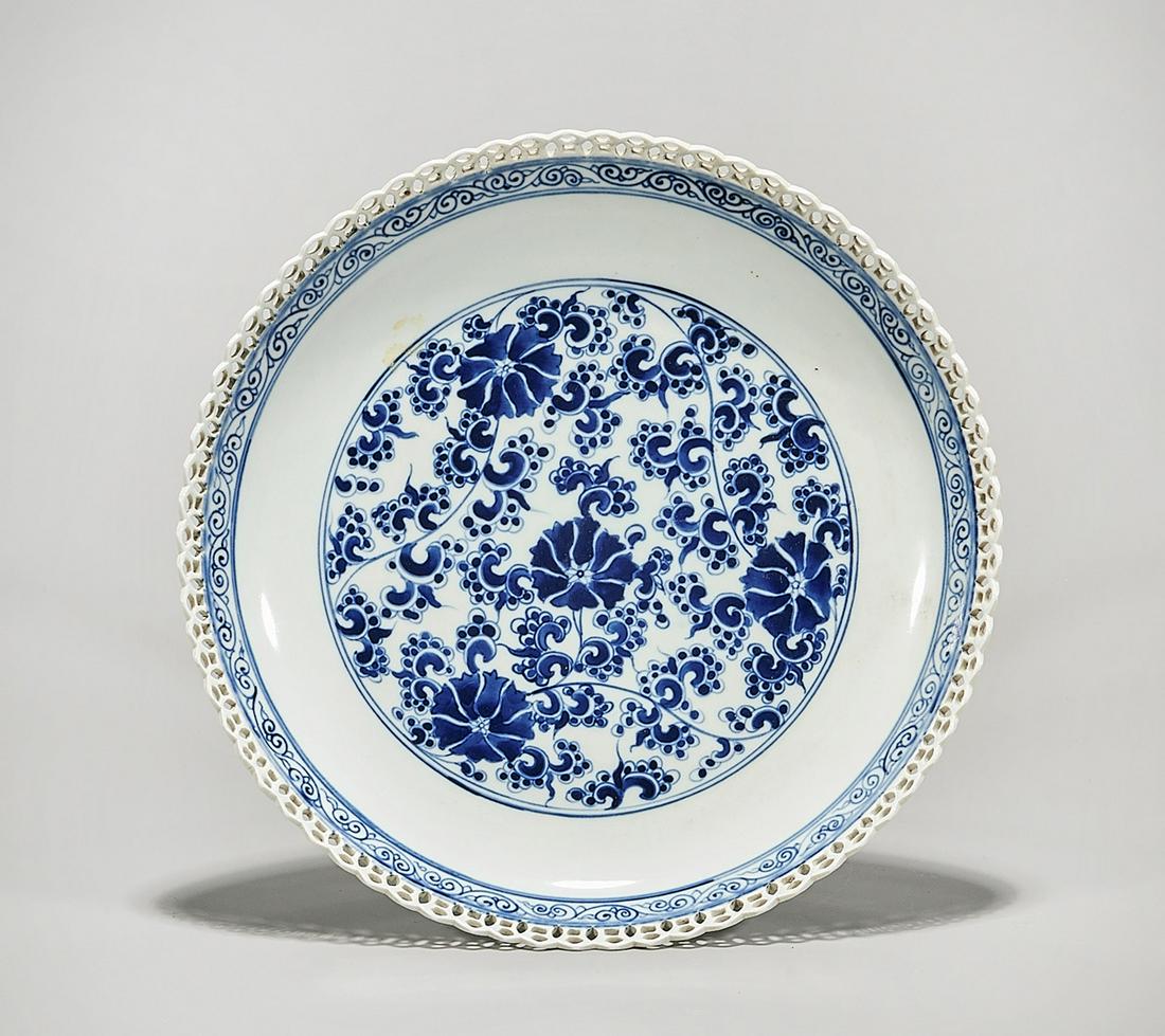Chinese Blue and White Porcelain Charger: Chinese blue and white porcelain charger; floral motif with openwork rim design; mark to base; D: 12" (approx.) Condition: general wear, frits, pits, minor losses