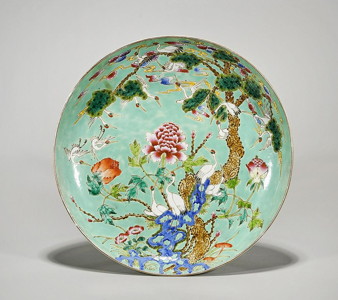 Chinese Enameled Porcelain Charger: Chinese enameled porcelain charger; turquoise glaze, with crane motif; D: 13" (approx.) Condition: general wear, frits, pits, minor losses