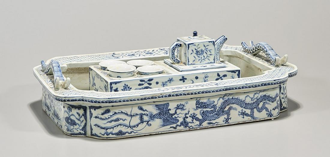 Chinese Blue and White Porcelain Tea Set: Chinese blue and white porcelain tea set; including handled tray, pot and cups; with various dragon and bird motifs; 5" x 17" x 12" (approx.) Condition: general wear, frits, pits, minor losses