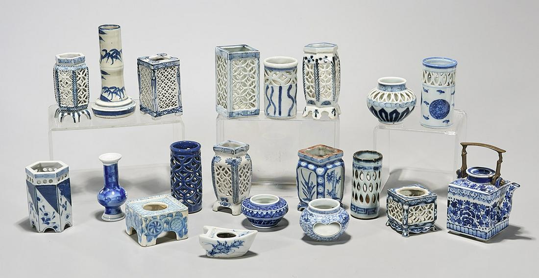 Large Group of Japanese Blue and White Porcelains: Large group of Japanese blue and white porcelains; including brush pot, containers, tea pot, vase and other pieces; approx. 20 pieces; 5 1/2" x 3" (largest, approx.) Condition: wear, minor losses